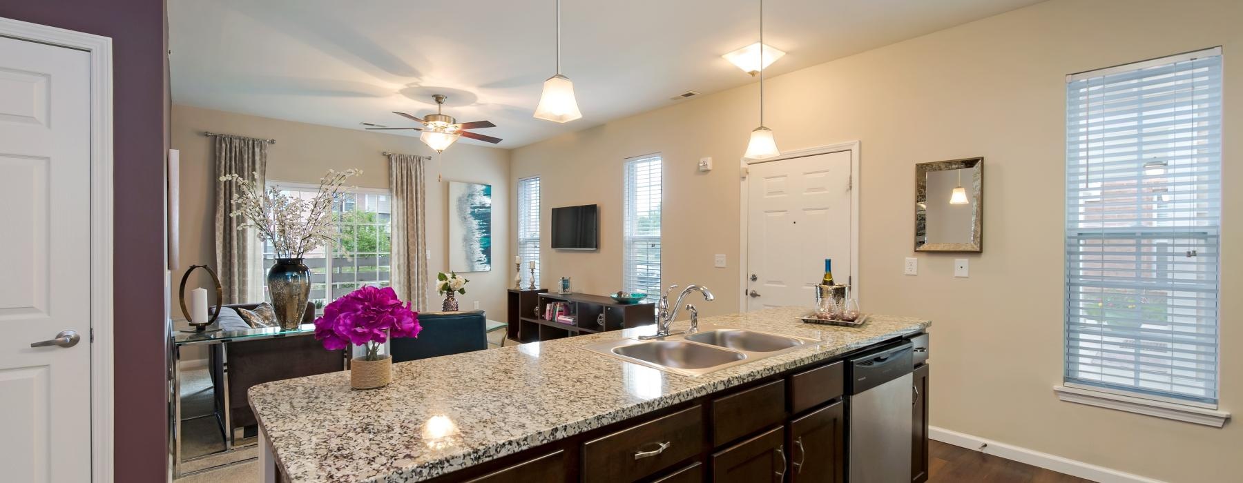 a kitchen with a marble island