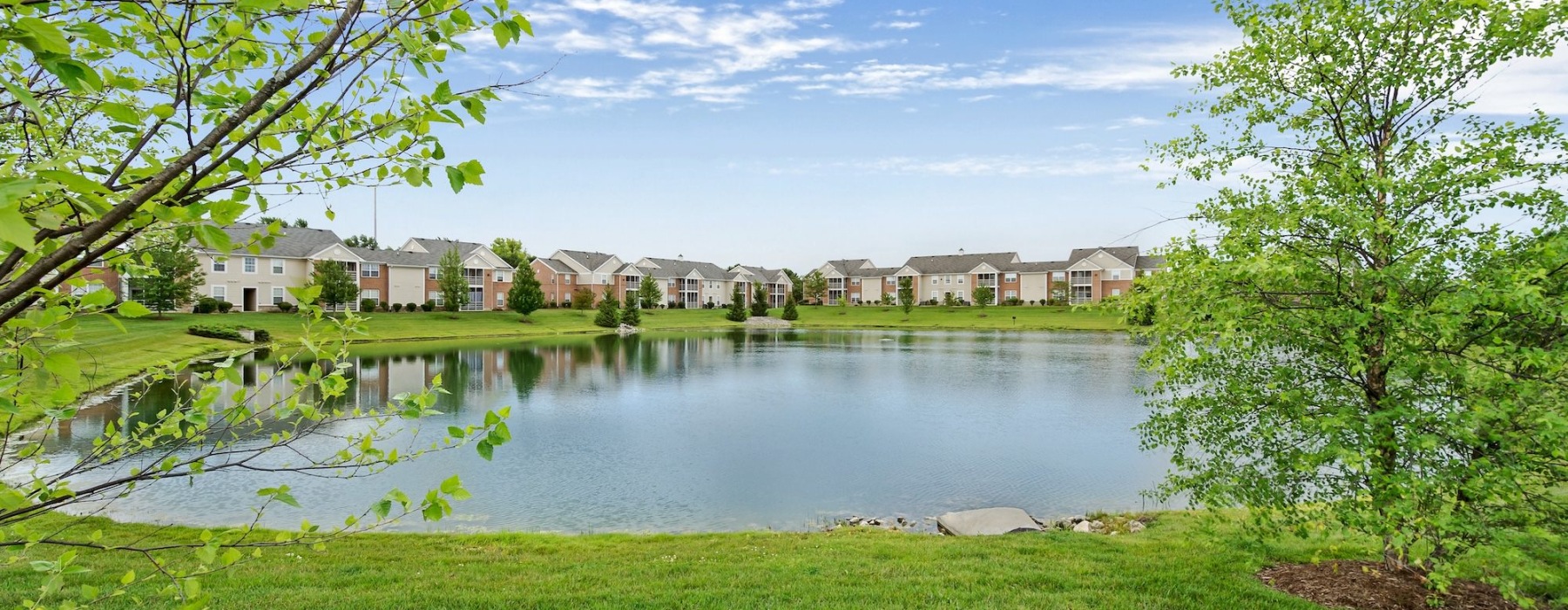 a large pond near many buildings