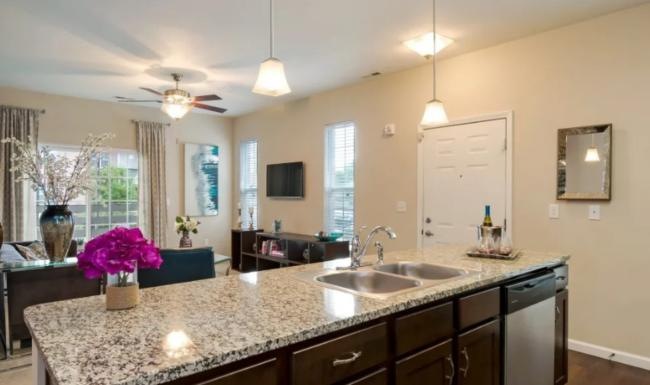 a kitchen with marble counters