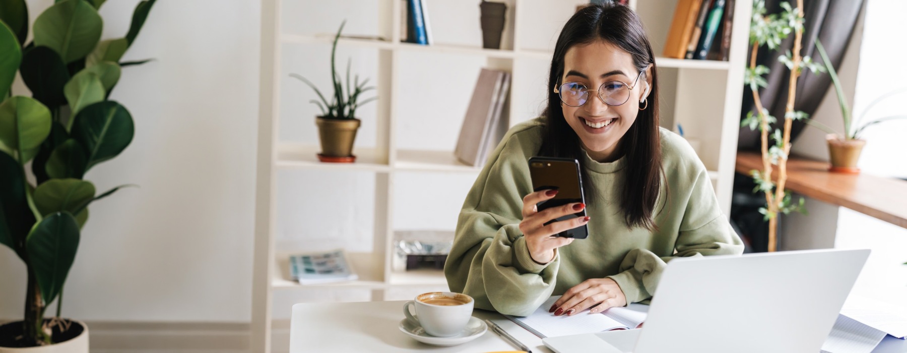 a woman holding a phone