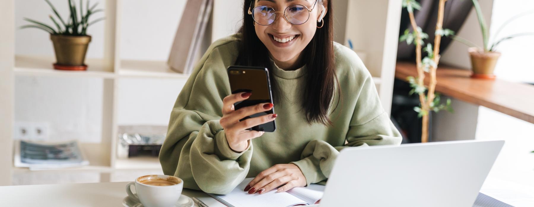 a woman holding a phone