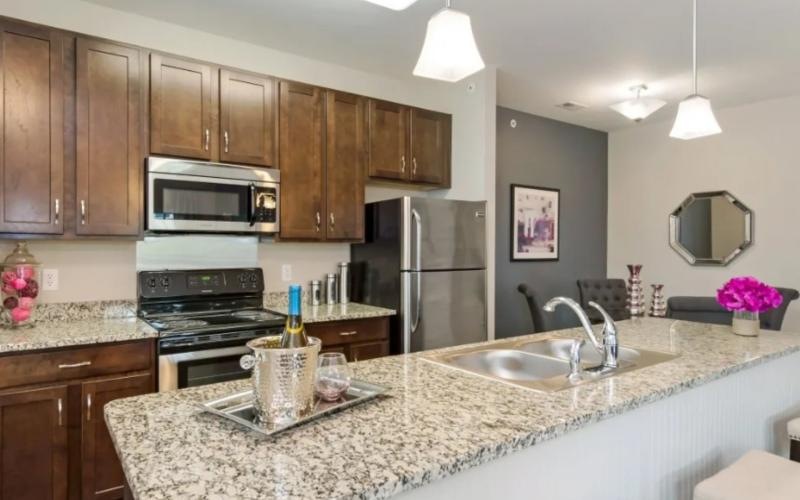 a kitchen with a marble counter top